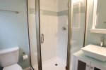 Full bath with glass enclosed shower